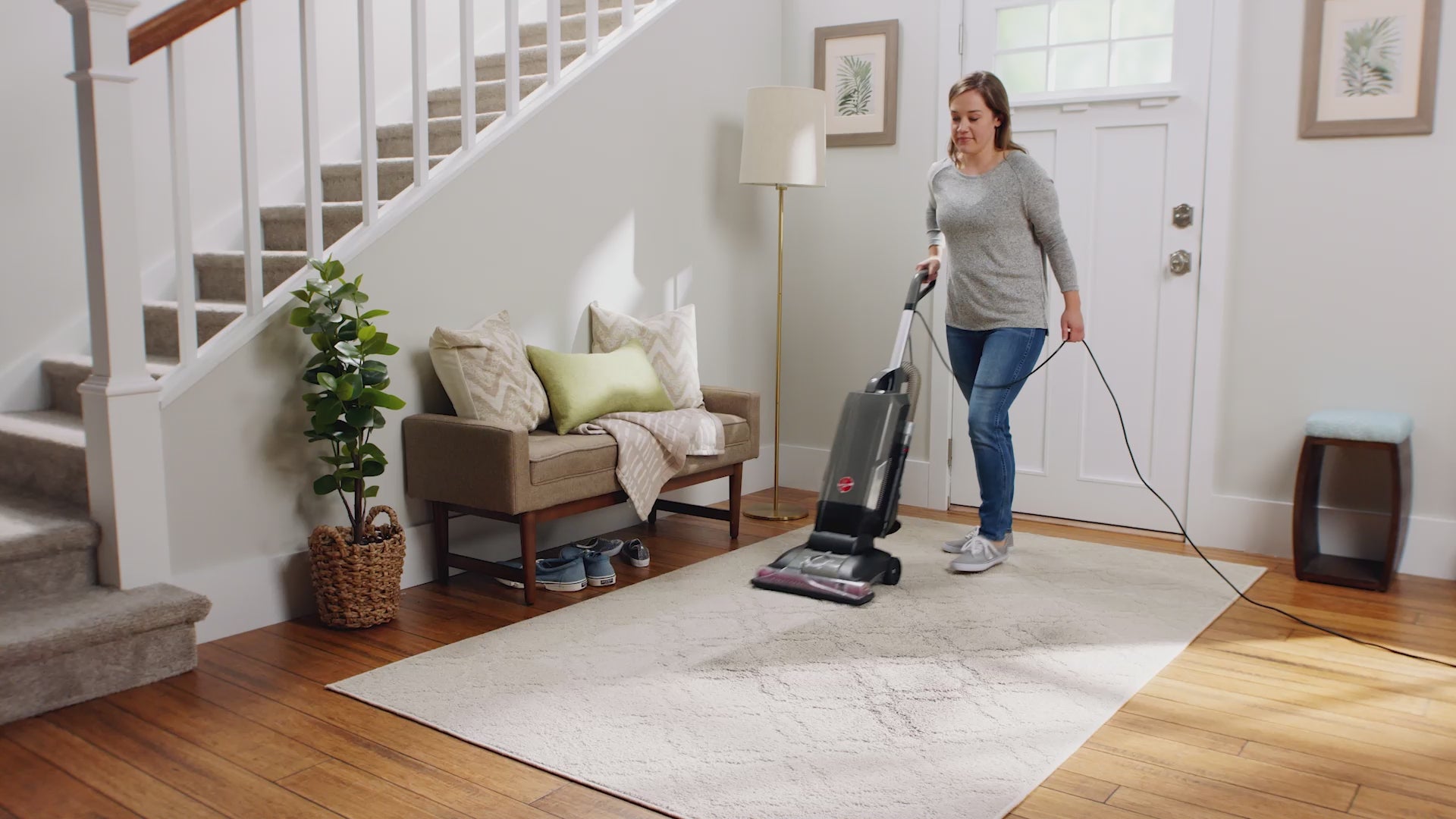 Load video: Person using the Hoover complete performance advanced bagged upright vacuum calling out it's Hoover's most powerful upright.  