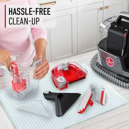 Hassle free clean up with Hoover cleanslate portable carpet and upholstery cleaner, featuring easy to dissemble parts for thorough cleaning and maintenance.  Cleanslate is sitting on the table next to the widepath tool, tight spot tool, and hose rinse tool 